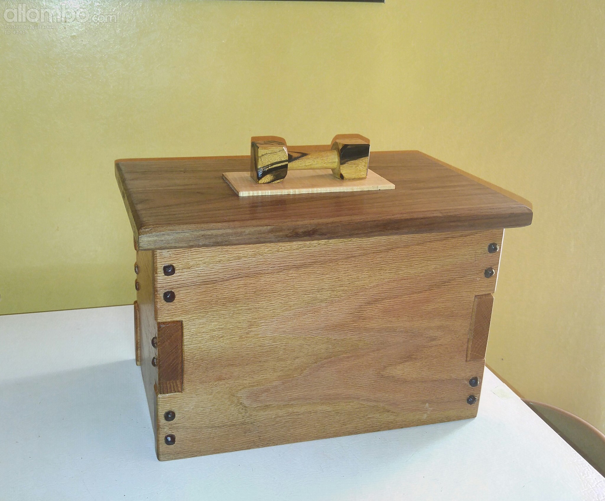 An urn I made for my ex brother-in-law. Called Greene and Greene style. This is made out of oak,walnut,maple and ebony(handle ) The top and pegs are walnut. Took 1 and a half days to make.