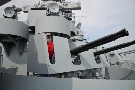 USS Alabama at port, big guns