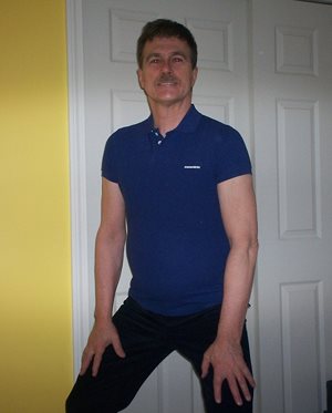 posing at home clad in a blue slim fit dsquared2 polo shirt