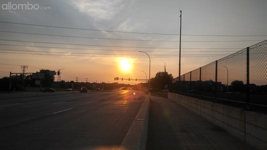 Walking over the highway. Sunset.