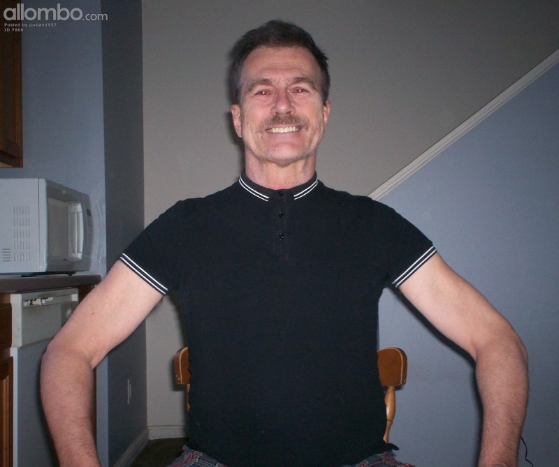 Portrait shot of me clad in a black polo shirt