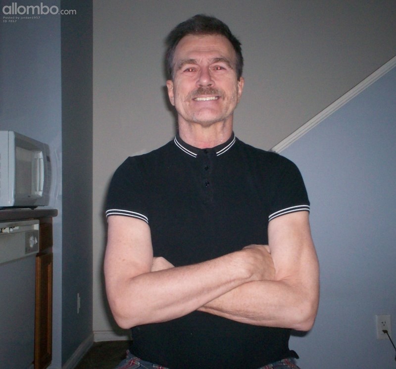 Portrait shot of me clad in a black polo shirt