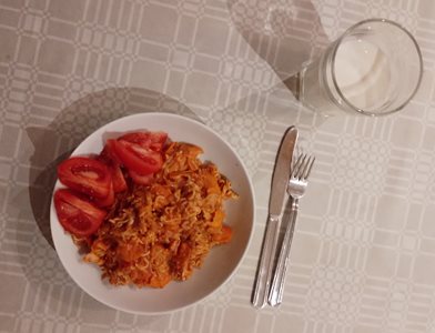 Noodles with tomato sauce contaning garlic, onion, carrots, milk and BACON