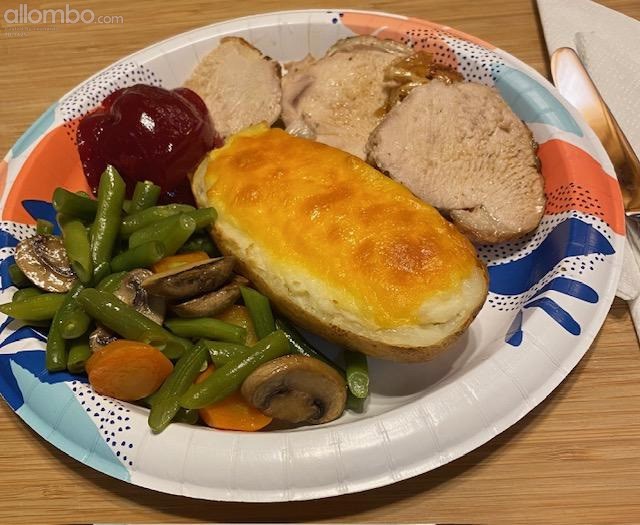 Turkey, twice baked potato, green beans with carrot and mushrooms, cranberry sauce