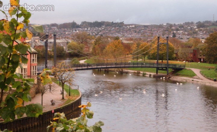 Footbridge over the River Exe at Haven Banks. In the background is St Thomas and the Dunsford Rd area.